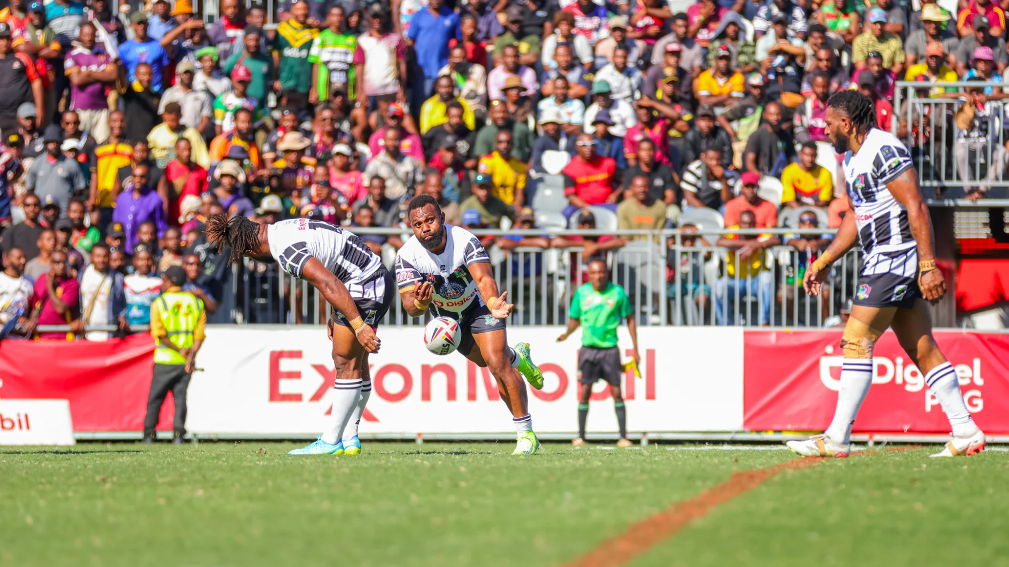 Digicel ExxonMobil Cup match action in front of a full crowd